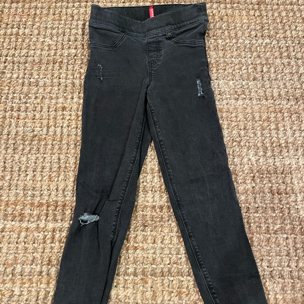 Spanx black distressed jeggings w raw hem, size XS